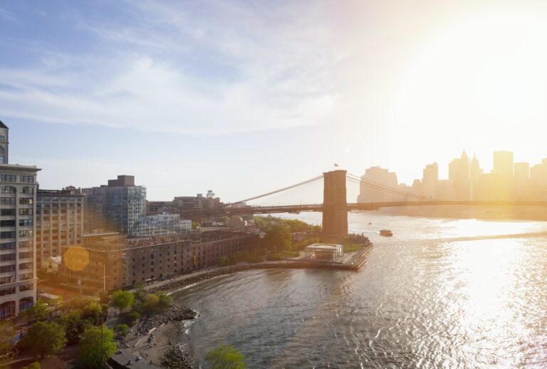 Elevated view of sunlit Brooklyn Bridge, New York, USA