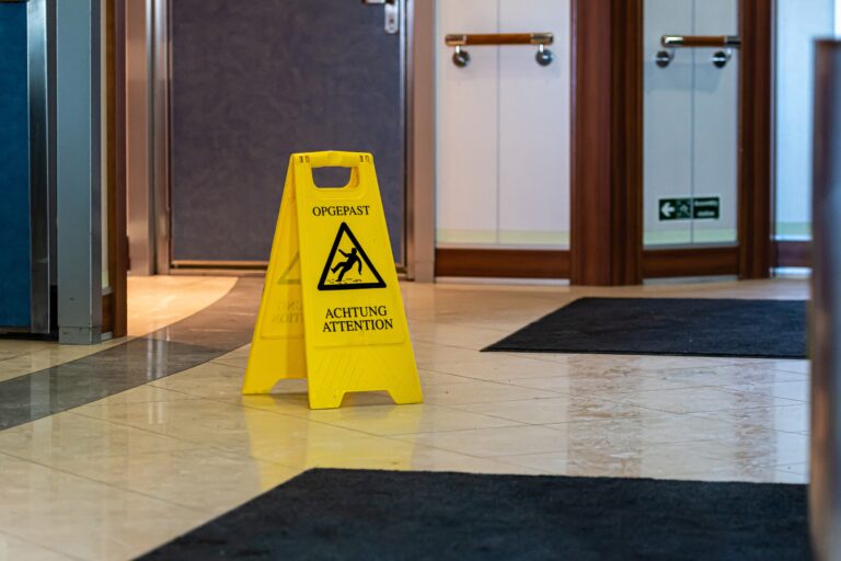 yellow wet floor warning sign and symbol on the passenger ferry restaurant floor